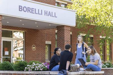 students on campus outside Borelli Hall