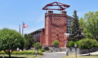 Costello Hall with flag in background