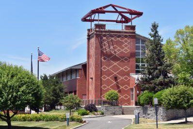 Costello Hall with flag in background