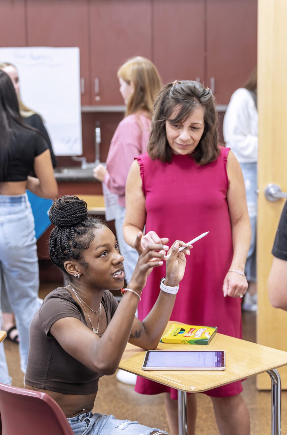 teacher and student talking