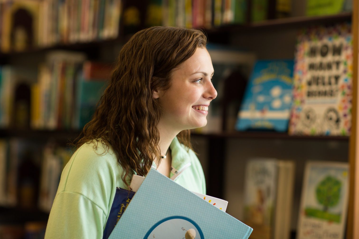 A female student with books in the background