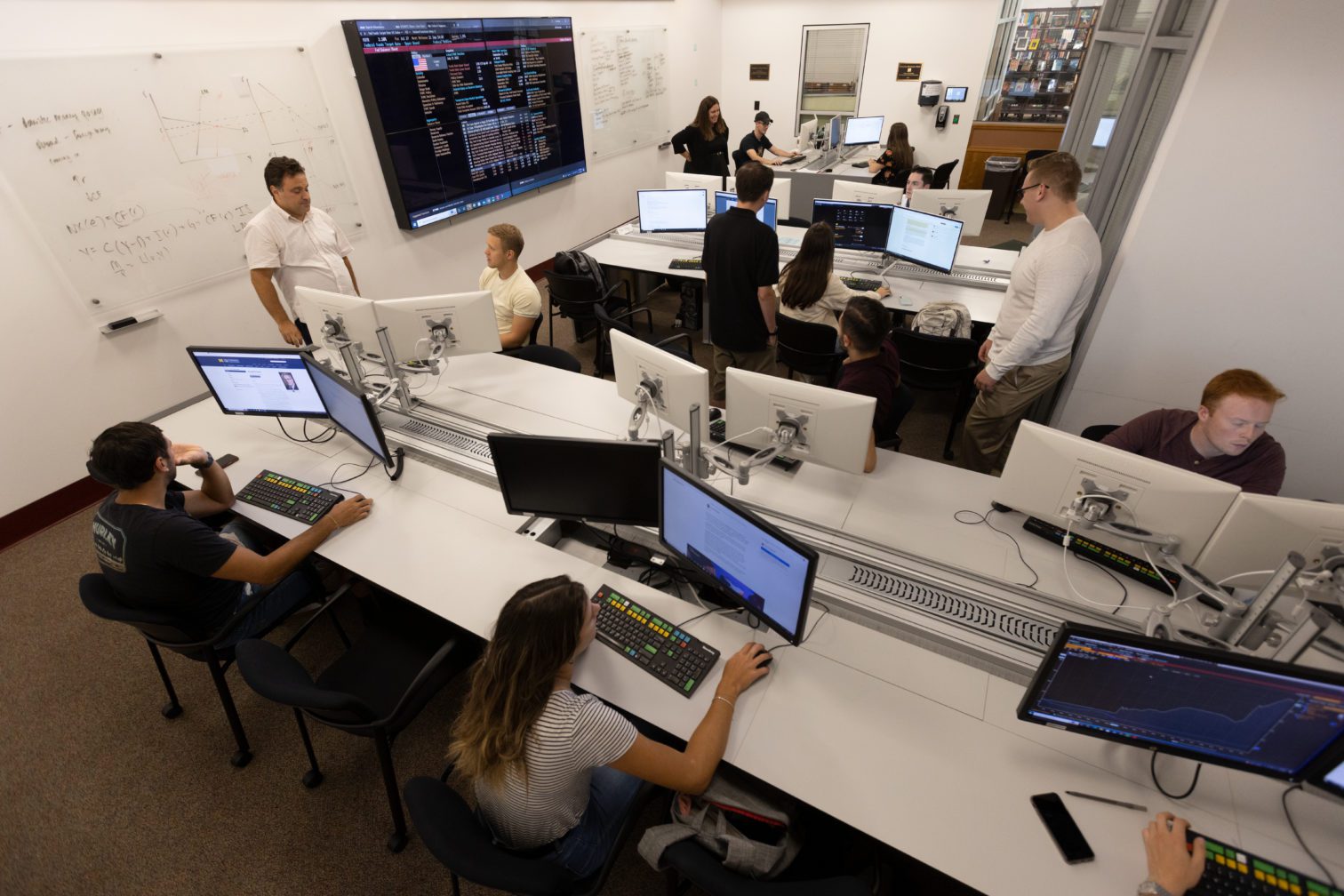 Students in the Bloomberg lab sitting at desks and working on computers.