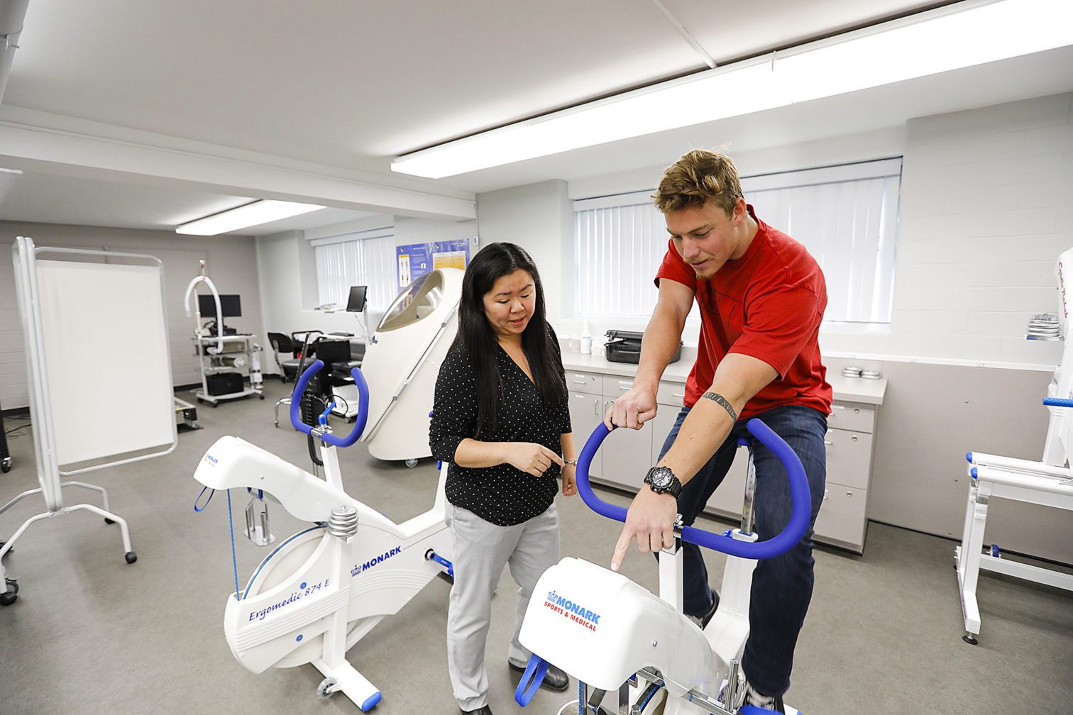 Dr. Berrios and a student in the exercise science lab.