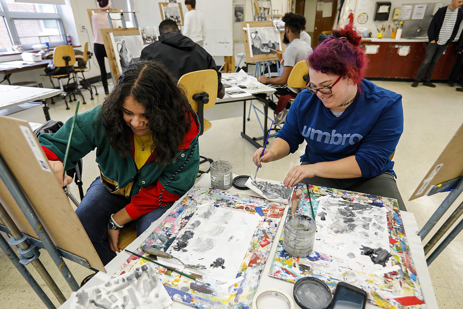 Students in the art studio painting.