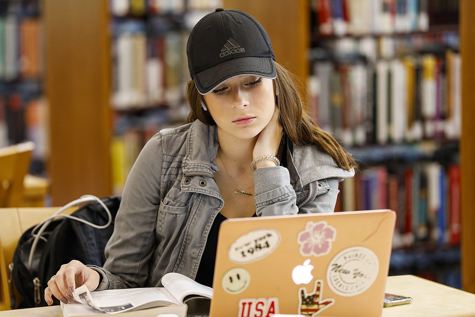 A female student studying at a desk.