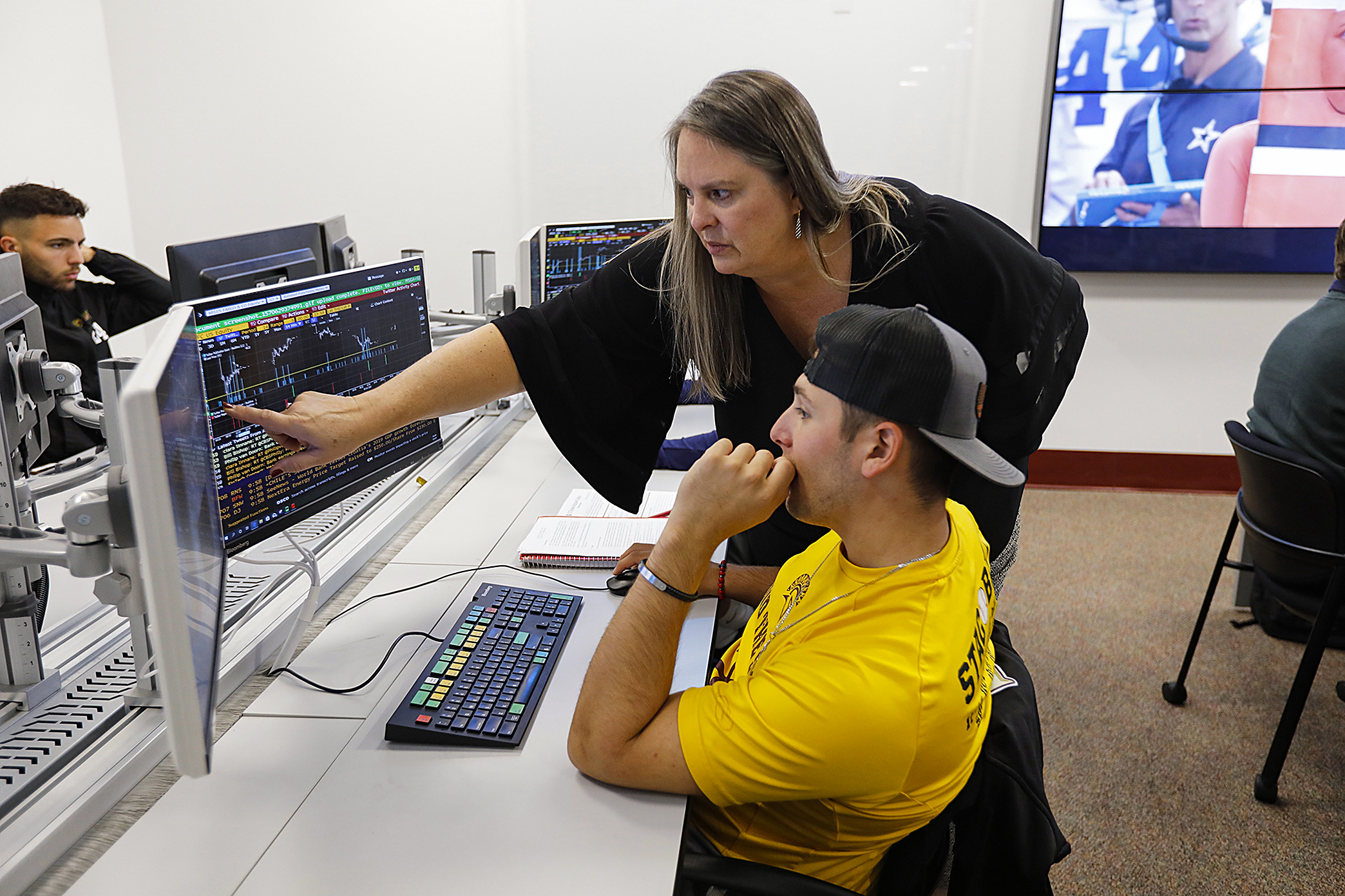 A student and his professor in the Bloomberg lab.