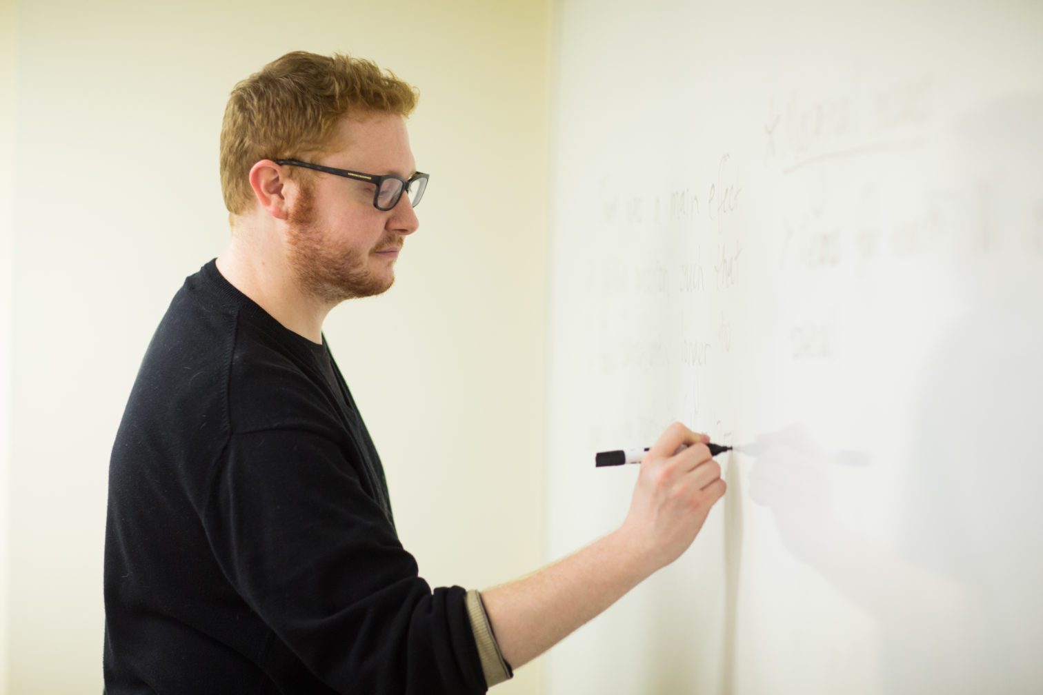 Dr. Wagner writing on a white board