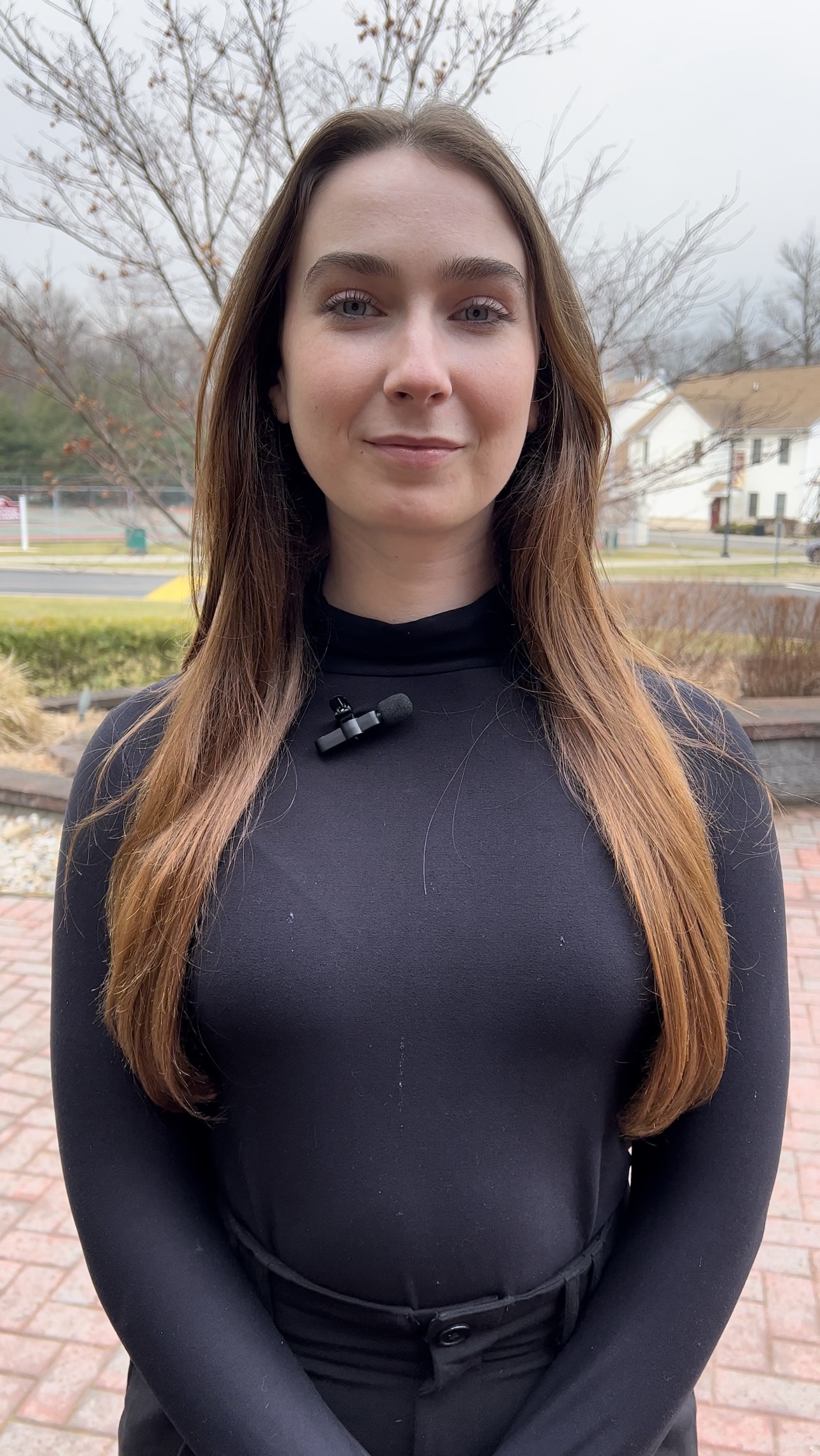 Meghan standing outside Spellman Hall on campus