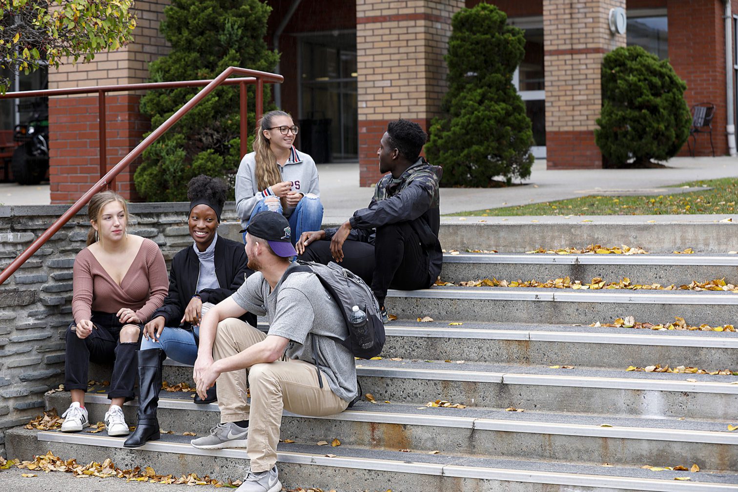 students sitting on stairs