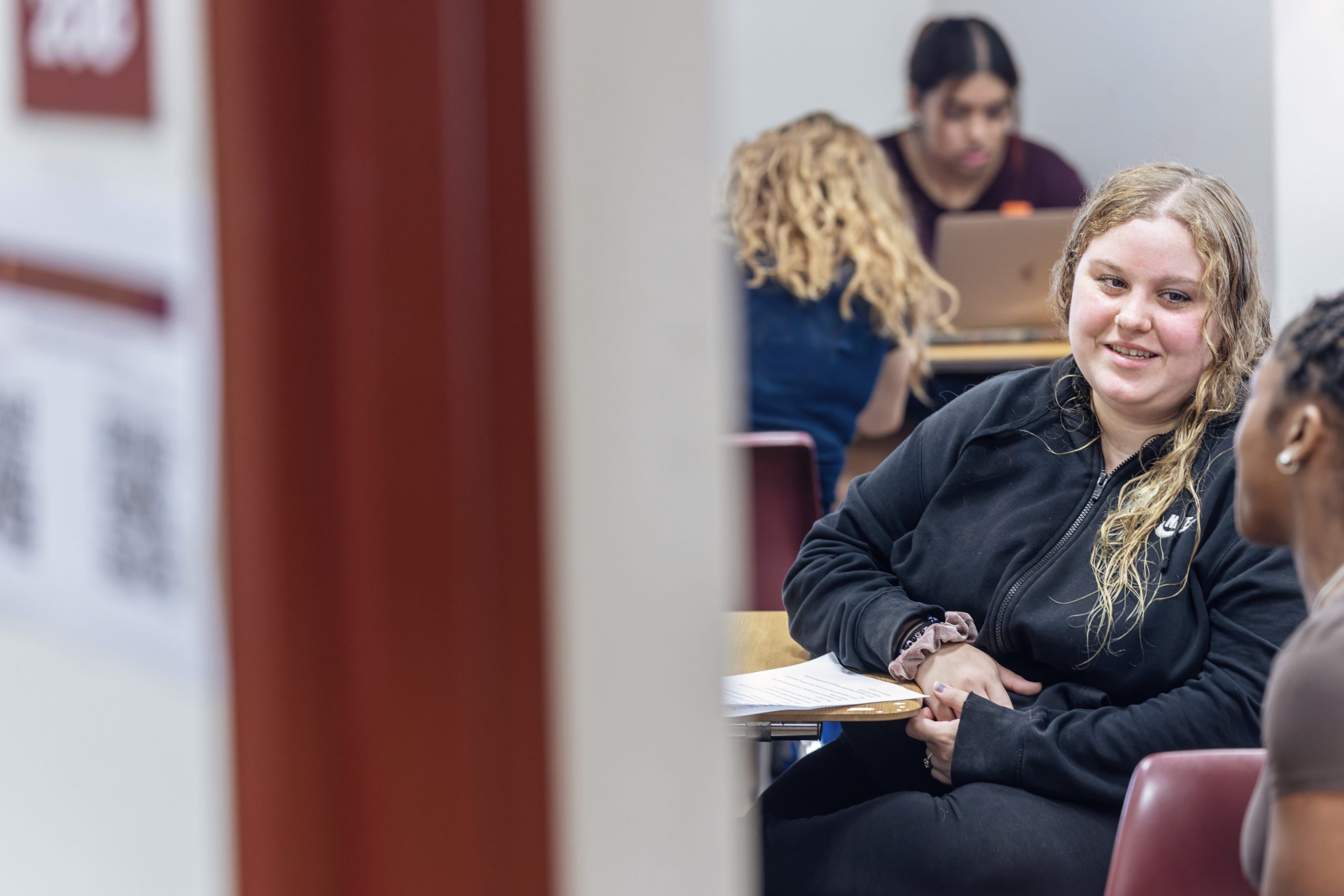 Students in sitting at desks in the classroom.