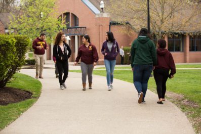 students walking on McNelis Commons