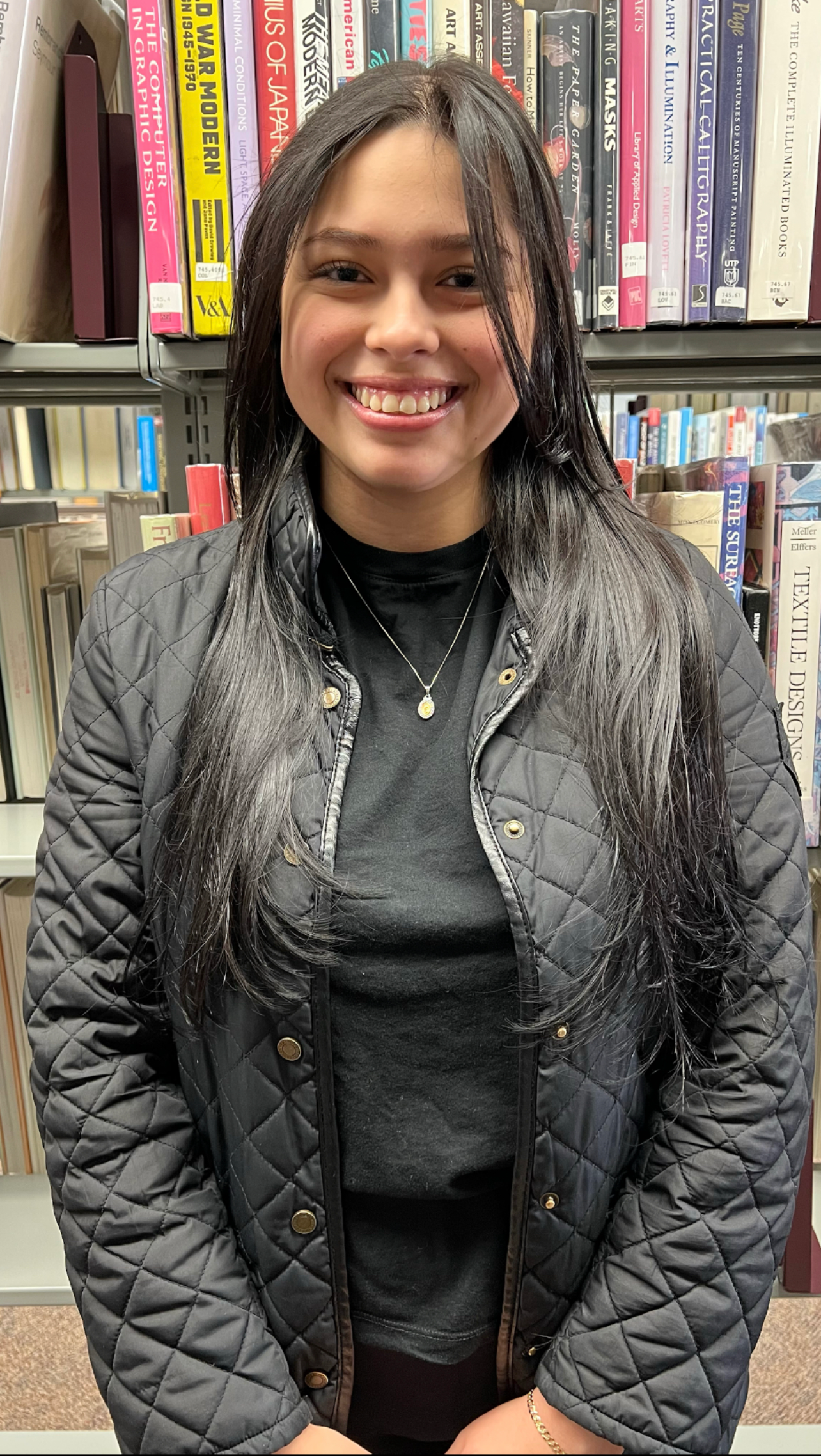 Karla Zamora in the Lougheed Library at St. Thomas Aquinas College