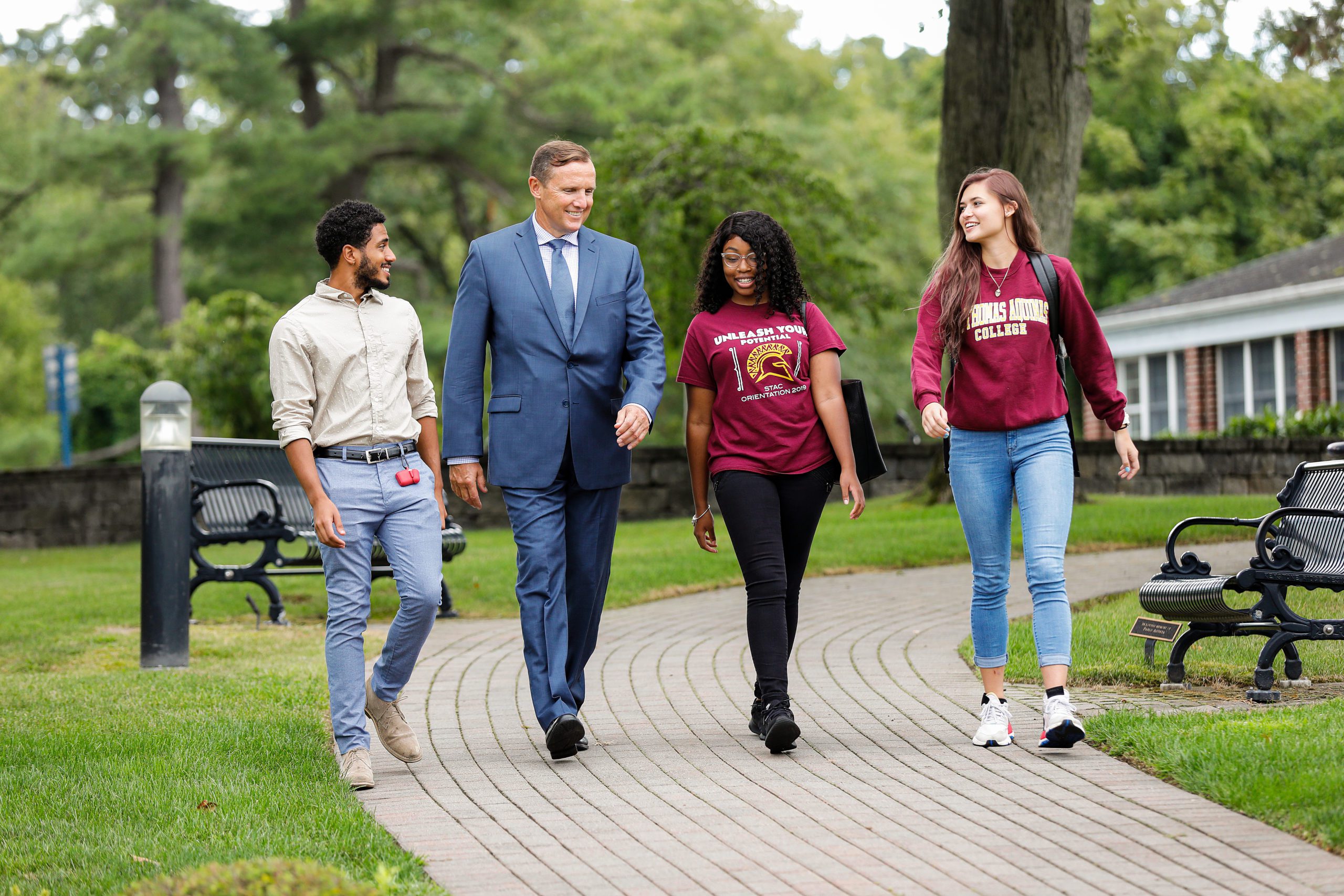President Daly walking with students