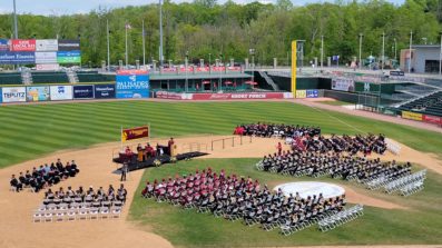 aerial image of commencement on field