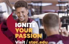 Ignite Your Passion visit stac.edu text and college logo in white with image in background of maroon torch and student in cafeteria smiling