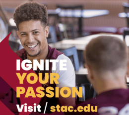Ignite Your Passion visit stac.edu text and college logo in white with image in background of maroon torch and student in cafeteria smiling