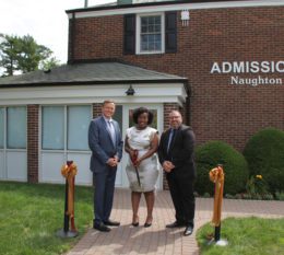 President Daly, Samantha Bazile, Mike DiBartolomeo in front of Naughton Hall for Admissions