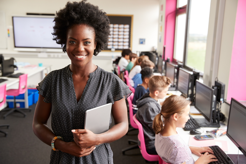 A female teacher and her students in a classroom