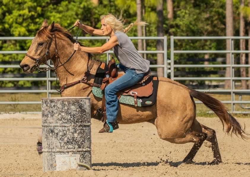 Jayden on horseback during a rodeo competition-candid