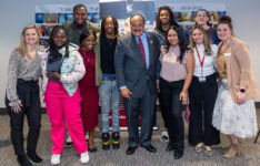 MLK III on campus with students and employees smiling for group photo