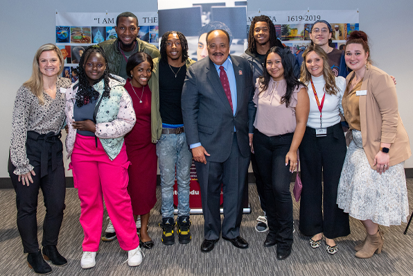 MLK III on campus with students and employees smiling for group photo