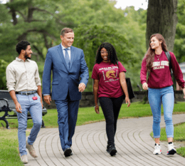 President Daly walking with students