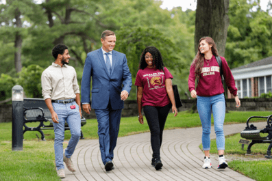 President Daly walking with students