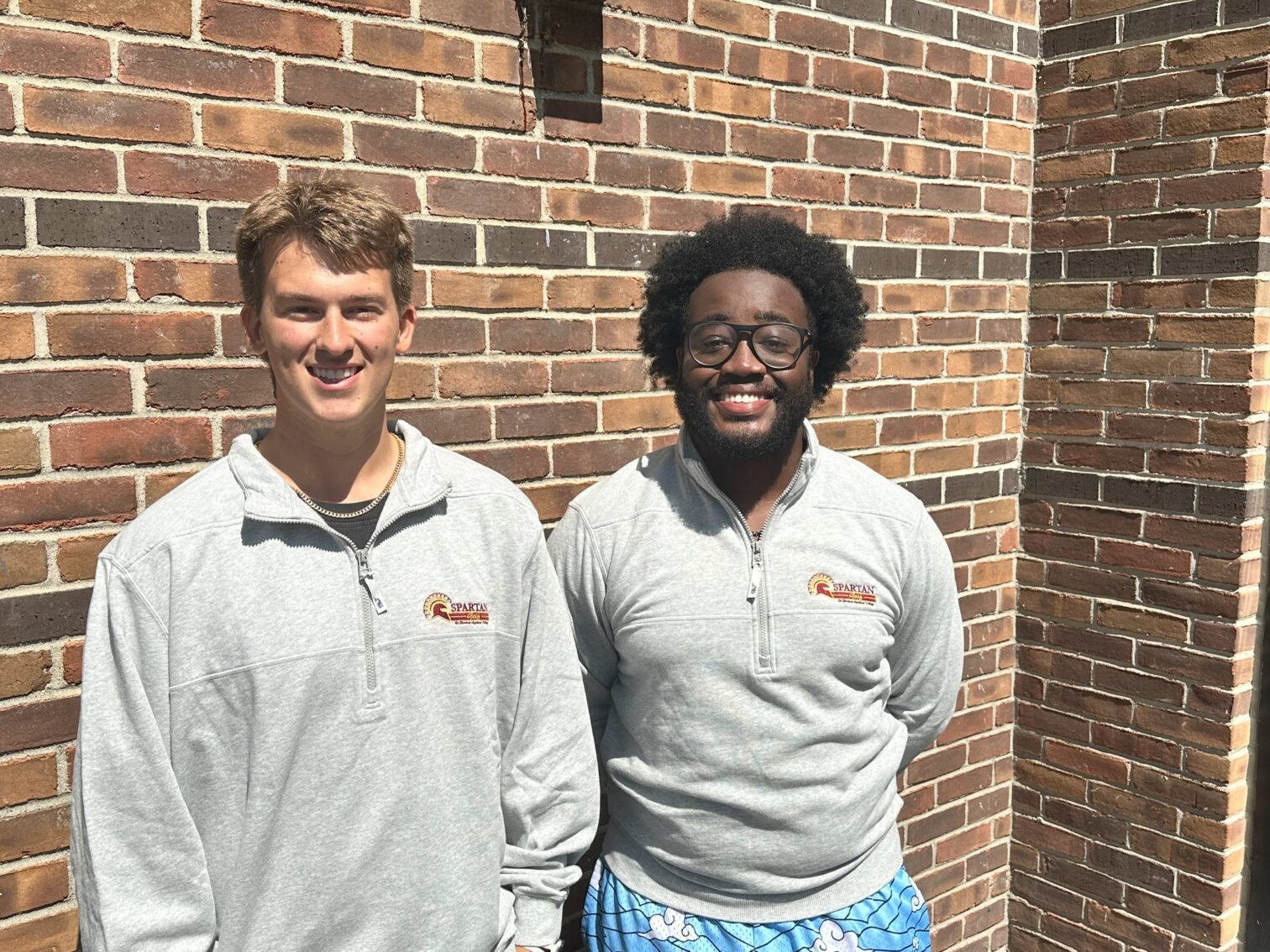 two male students wearing Quarter Zip Pullovers