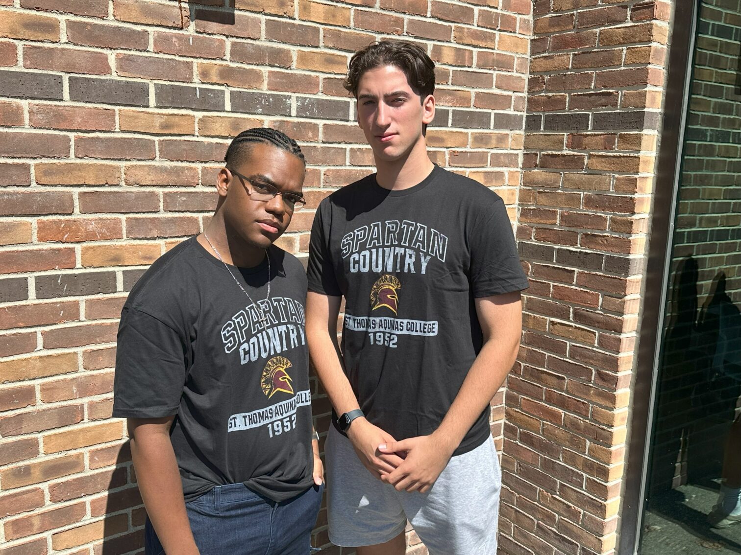 two students wearing spartan country t-shirts