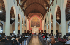 Sacred Heart Chapel filled with students and members of the STAC community for New Student Convocation with altar in background