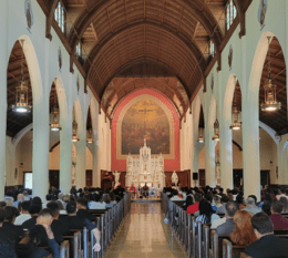 Sacred Heart Chapel filled with students and members of the STAC community for New Student Convocation with altar in background