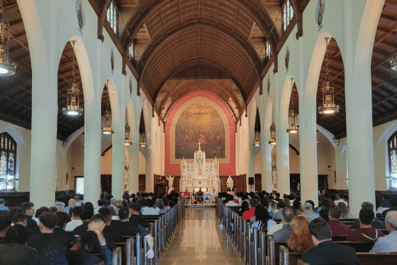 Sacred Heart Chapel filled with students and members of the STAC community for New Student Convocation with altar in background