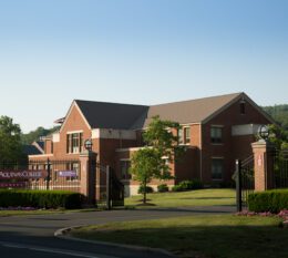 Borelli Hall entrance with building and blue sky in background