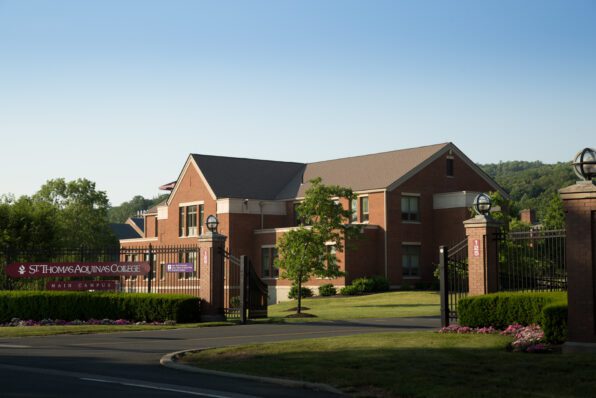 Borelli Hall entrance with building and blue sky in background