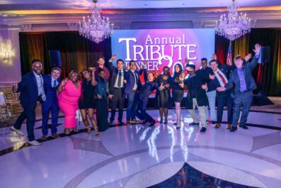 Annual Tribute Dinner guests posing and smiling